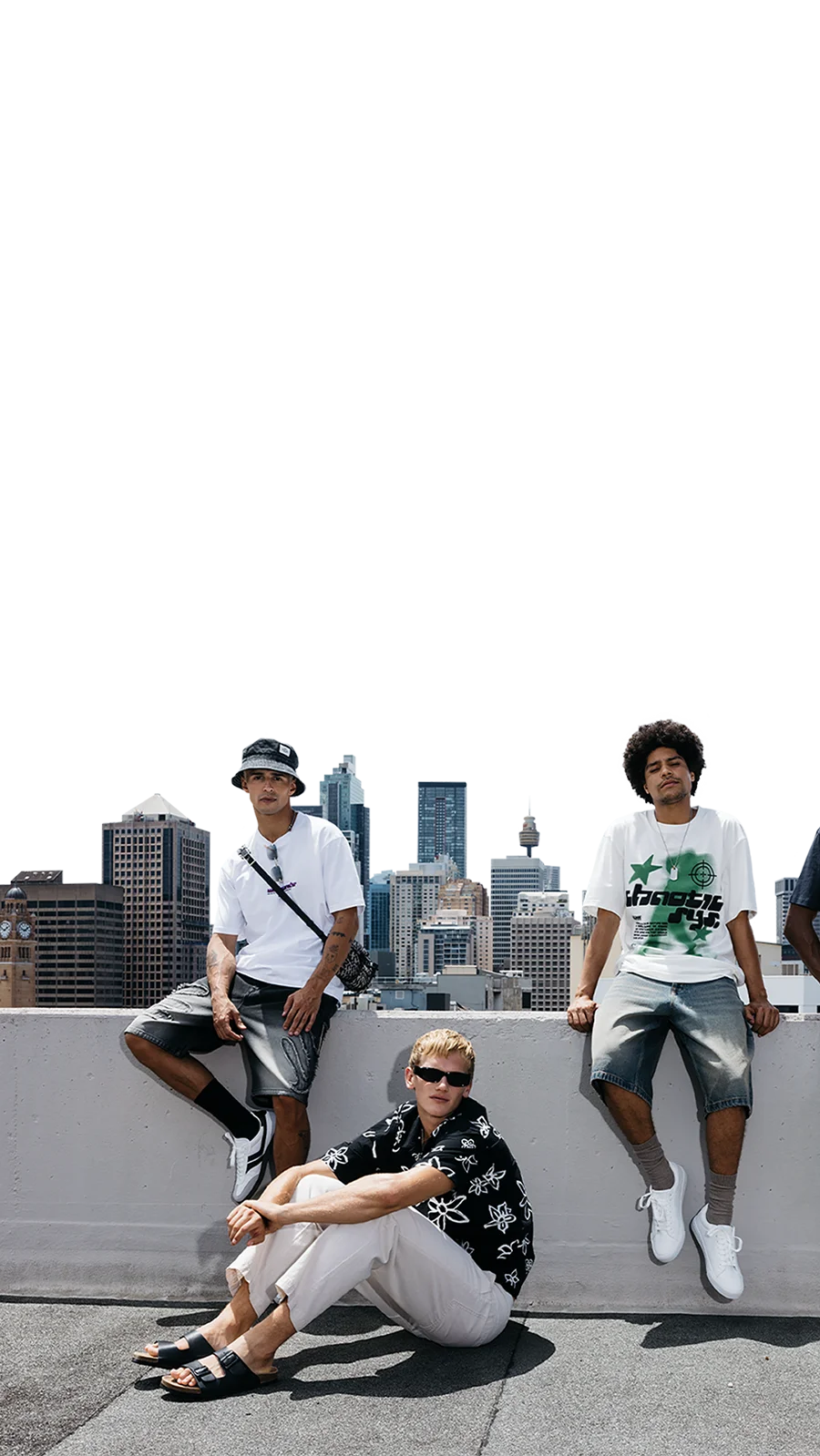 3 guys in front of a skyline